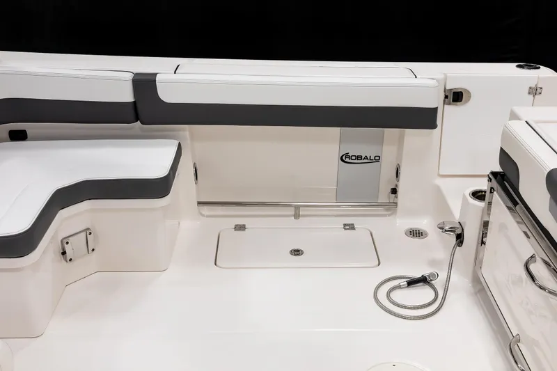  Yacht Photos Pics 2026 Robalo R277 Dual Console boat interior with seating and storage compartments.