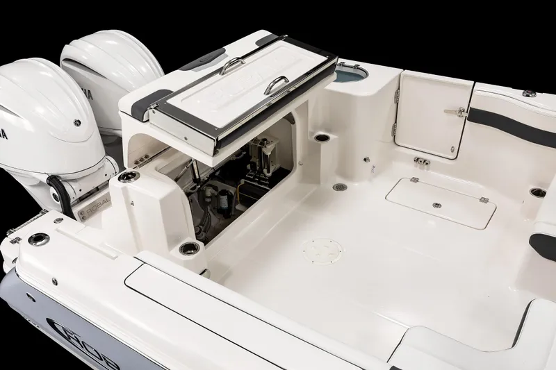  Yacht Photos Pics 2026 Robalo R277 Dual Console boat interior with dual engines and storage compartments.