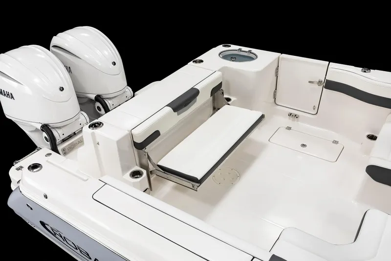  Yacht Photos Pics 2026 Robalo R277 Dual Console boat interior with Yamaha engines, featuring seating and storage compartments.