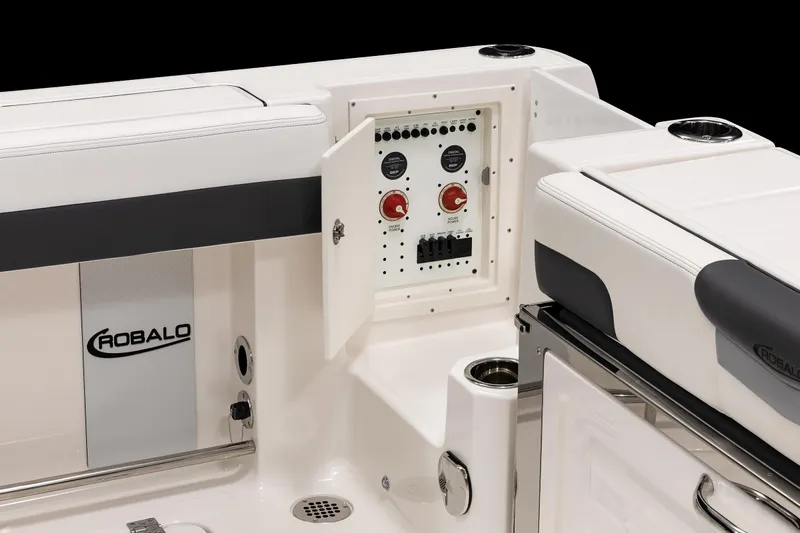  Yacht Photos Pics 2026 Robalo R277 Dual Console boat interior with control panel and seating.