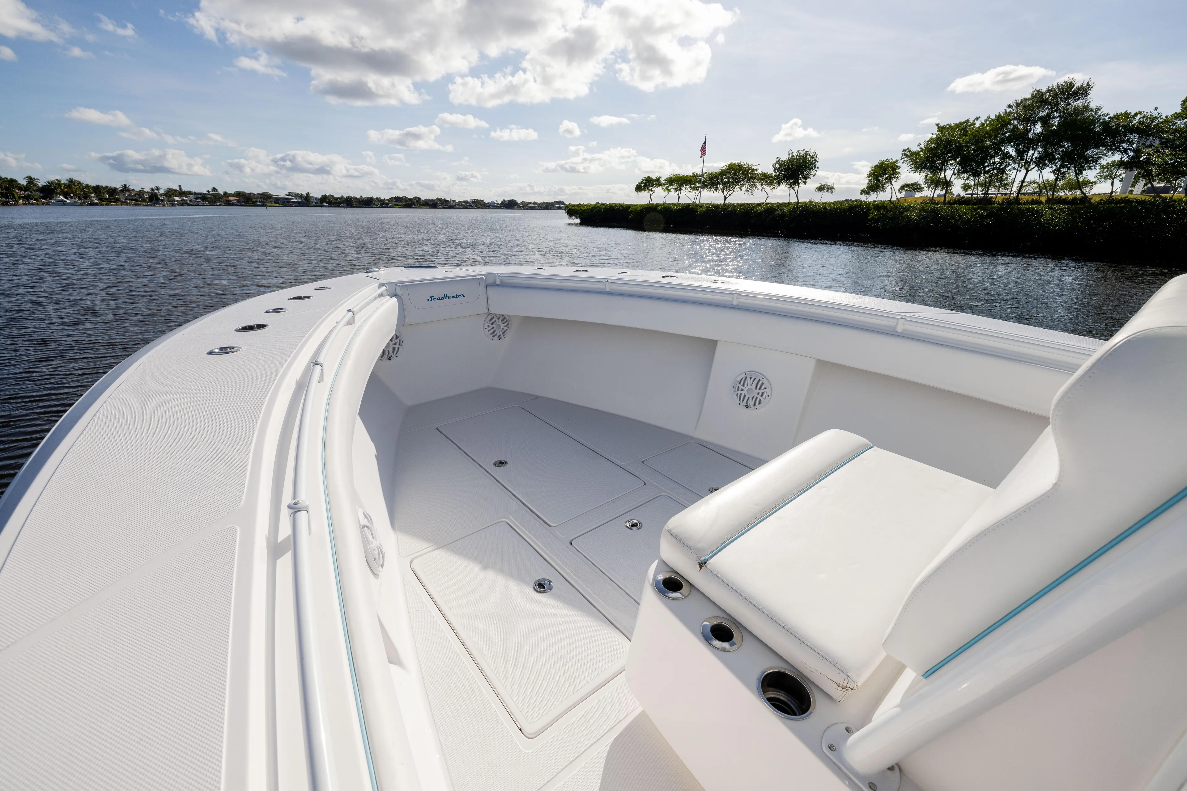 Bloodline Yacht Photos Pics 2018 SeaHunter 33' Center Console boat on calm water, sunny day.