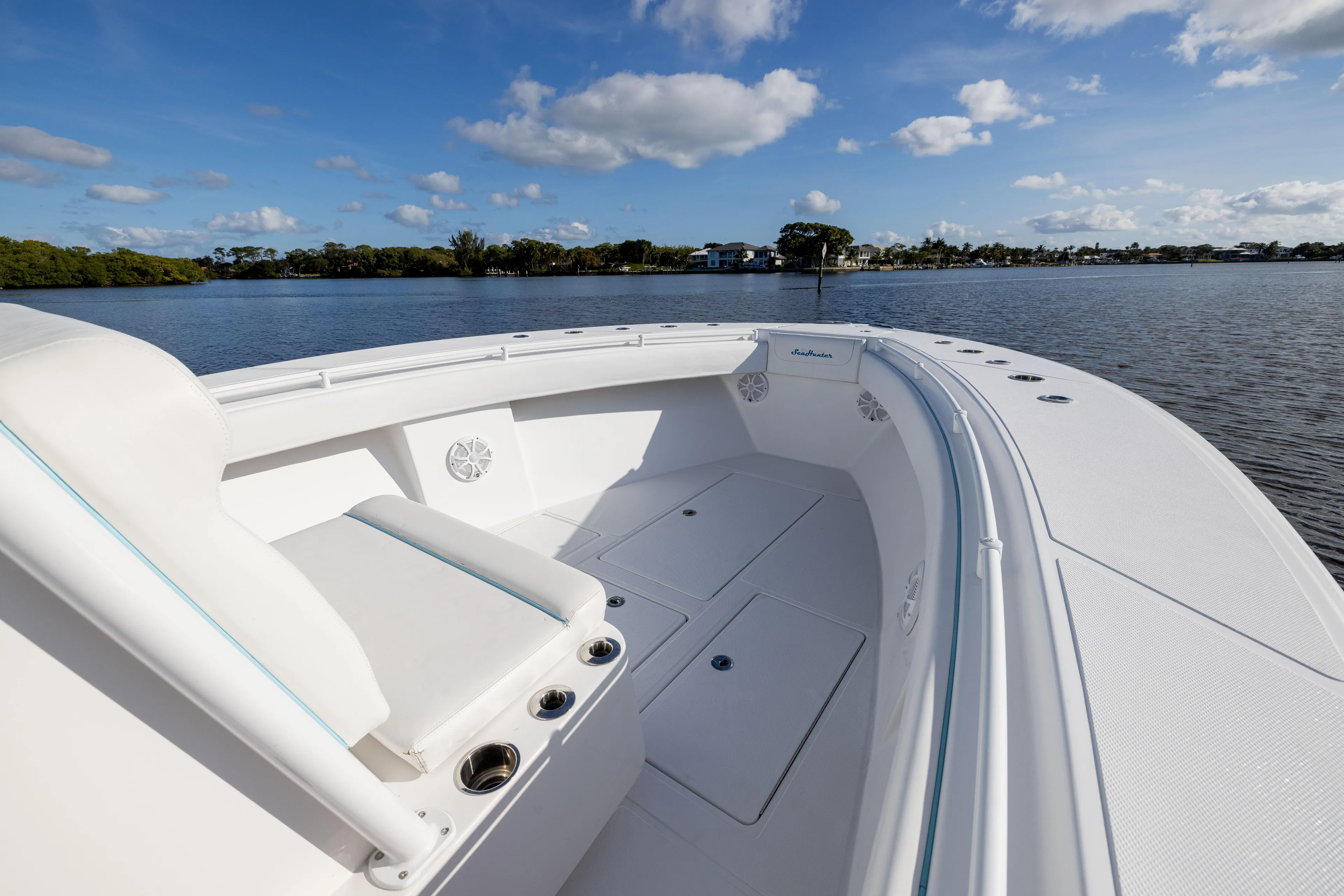 Bloodline Yacht Photos Pics 2018 SeaHunter 33' Center Console boat on calm water, clear sky.