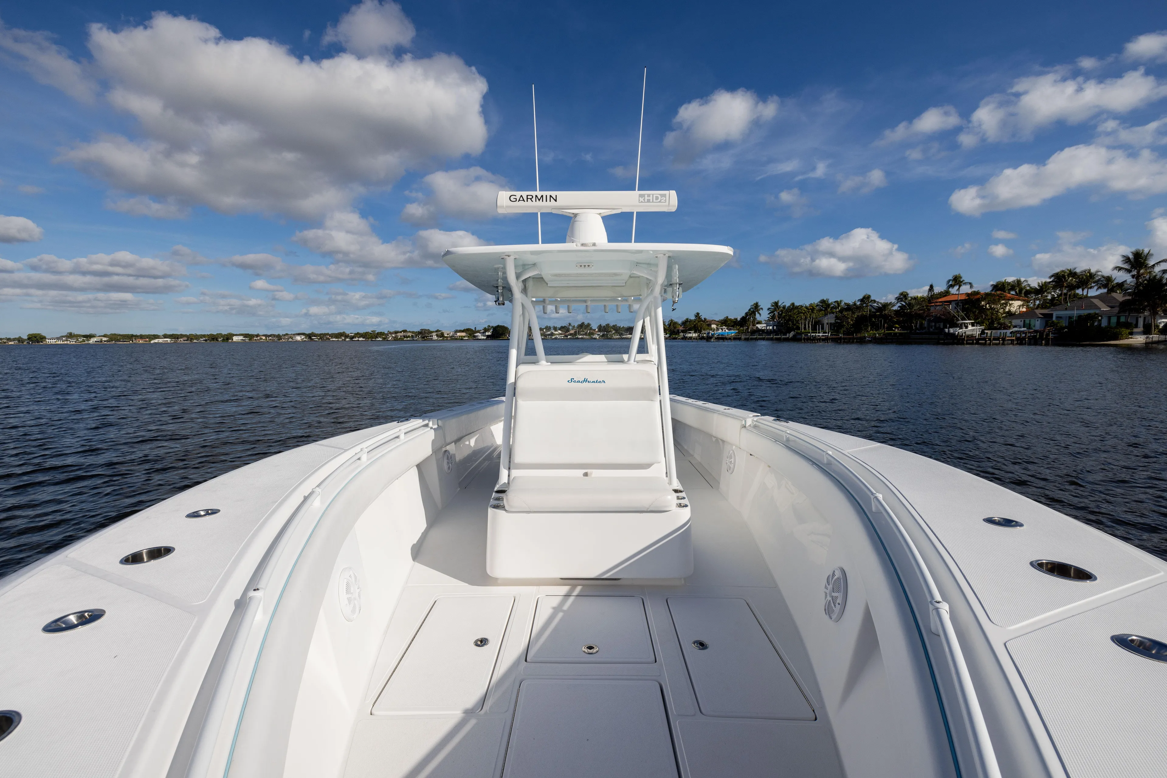 Bloodline Yacht Photos Pics 2018 SeaHunter 33' Center Console boat on calm water under blue sky.