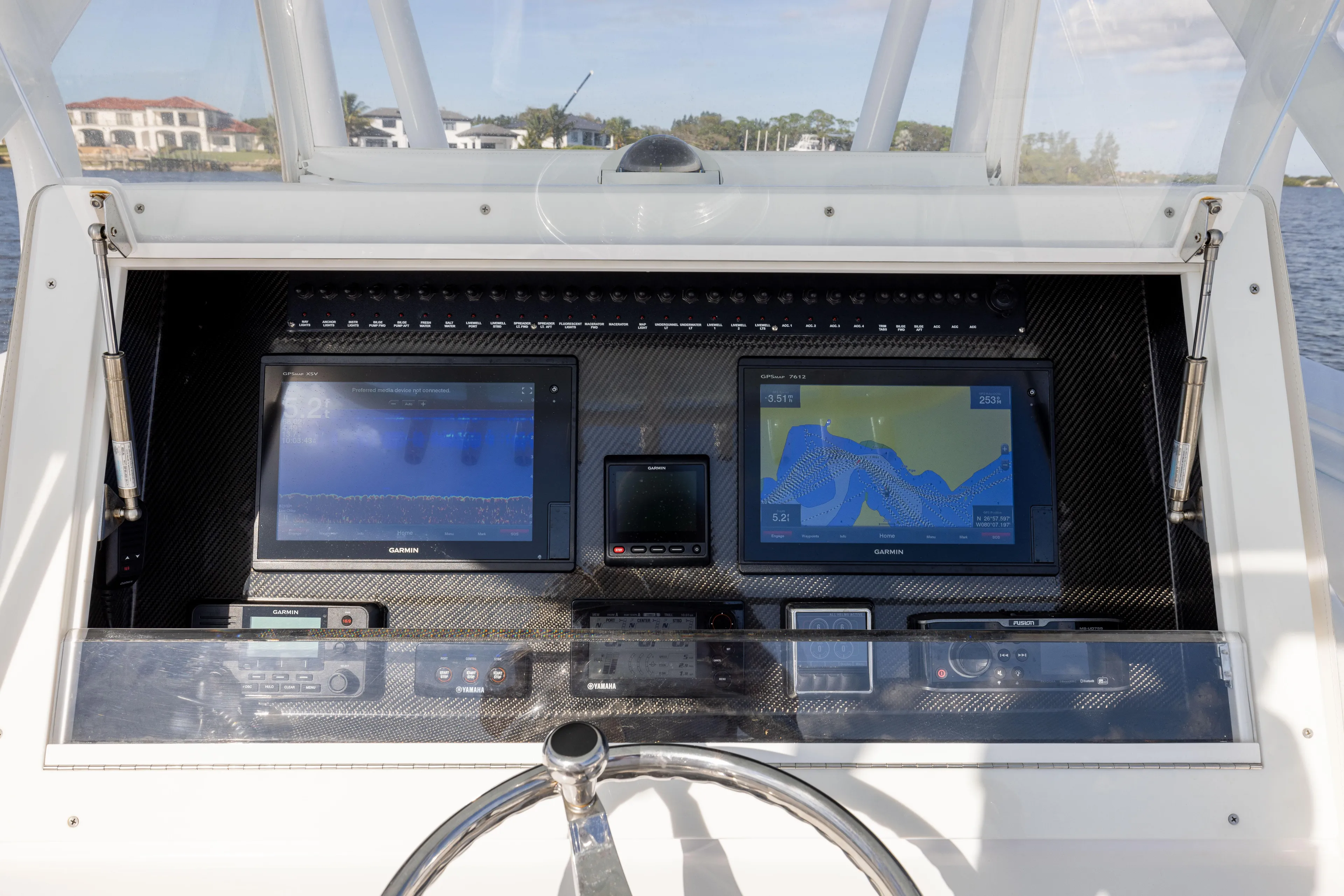 Bloodline Yacht Photos Pics 2018 SeaHunter 33' Center Console dashboard with navigation screens and controls.