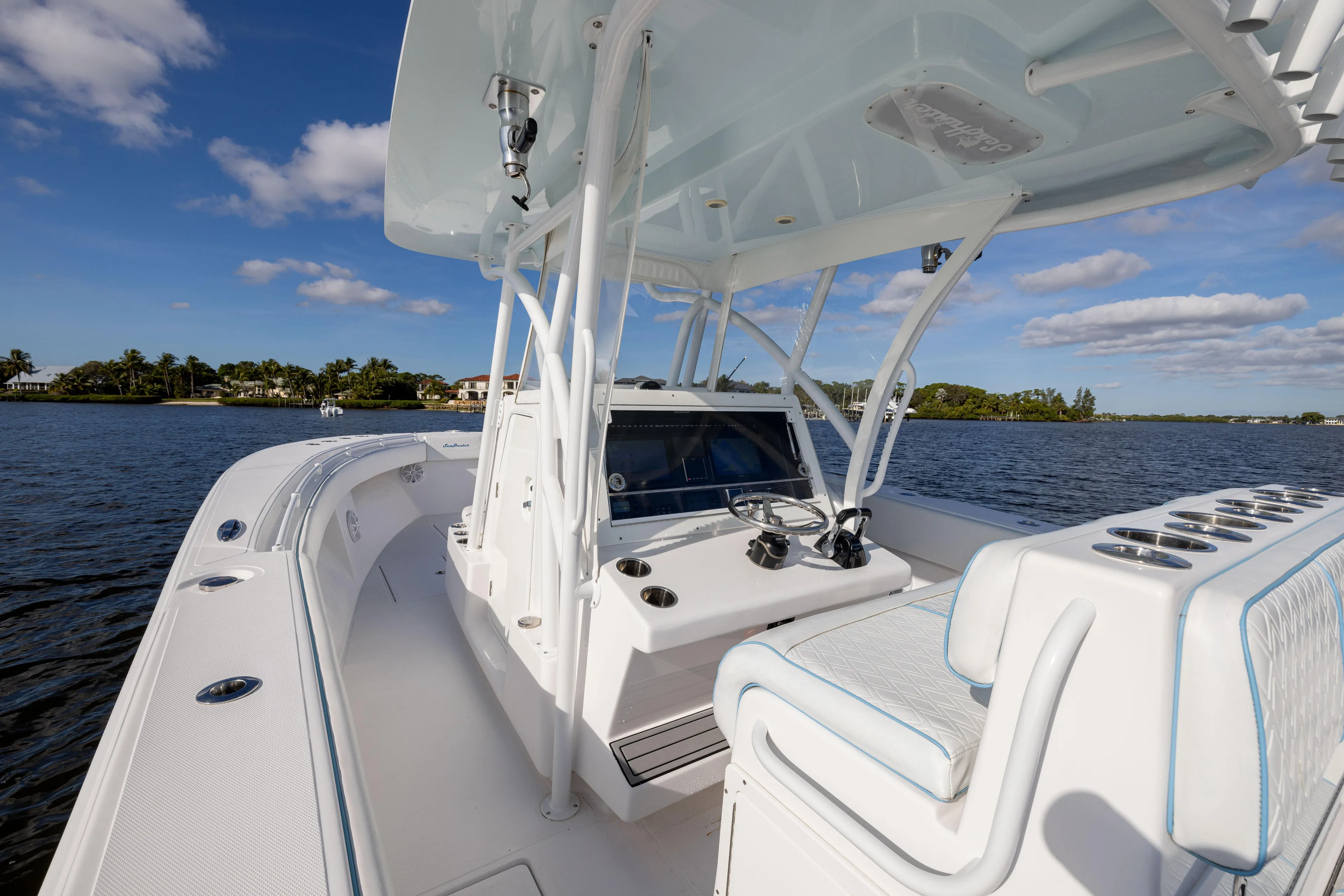 Bloodline Yacht Photos Pics 2018 SeaHunter 33' Center Console boat on calm water under blue sky.