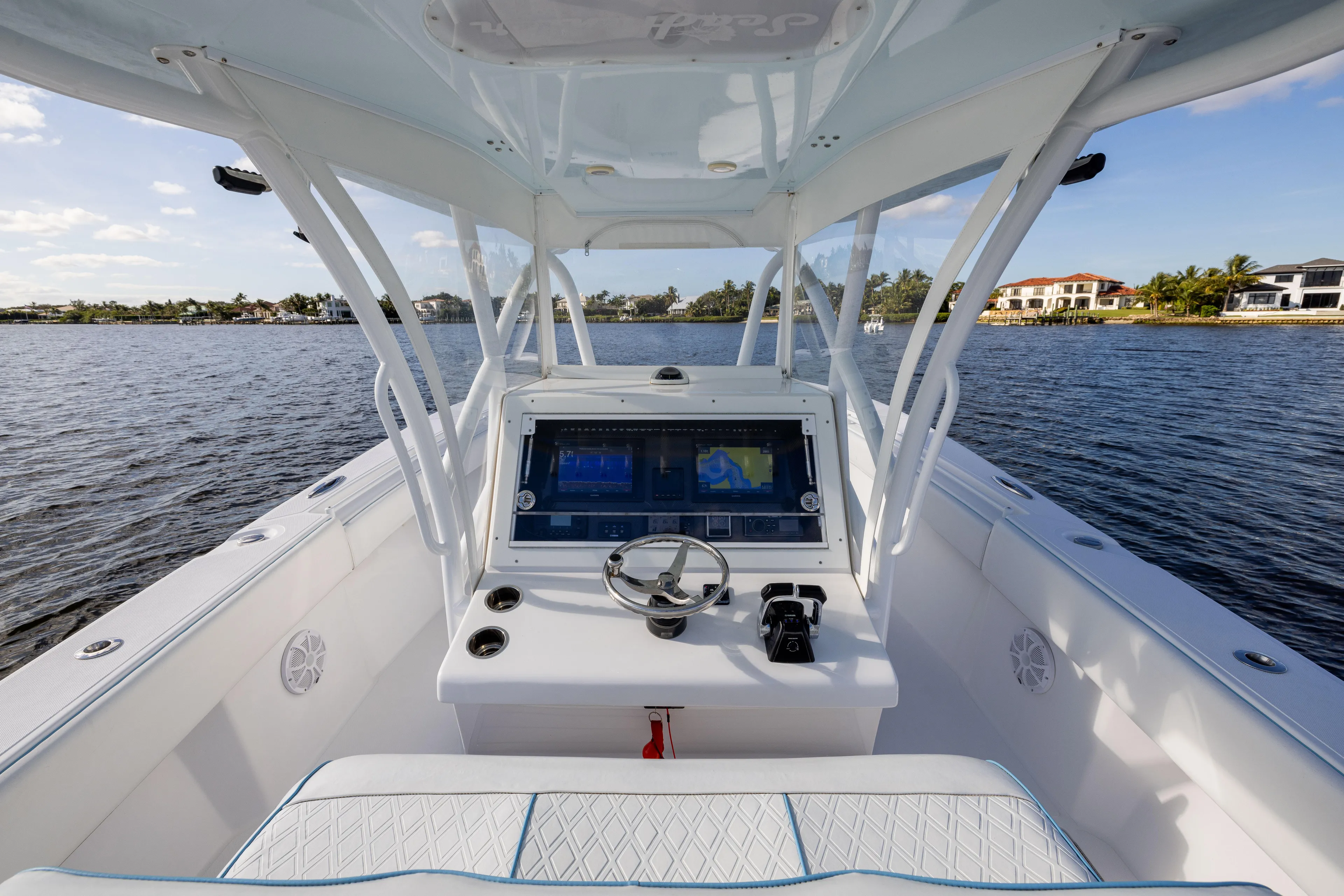 Bloodline Yacht Photos Pics 2018 SeaHunter 33' Center Console boat on calm water, featuring modern navigation equipment.