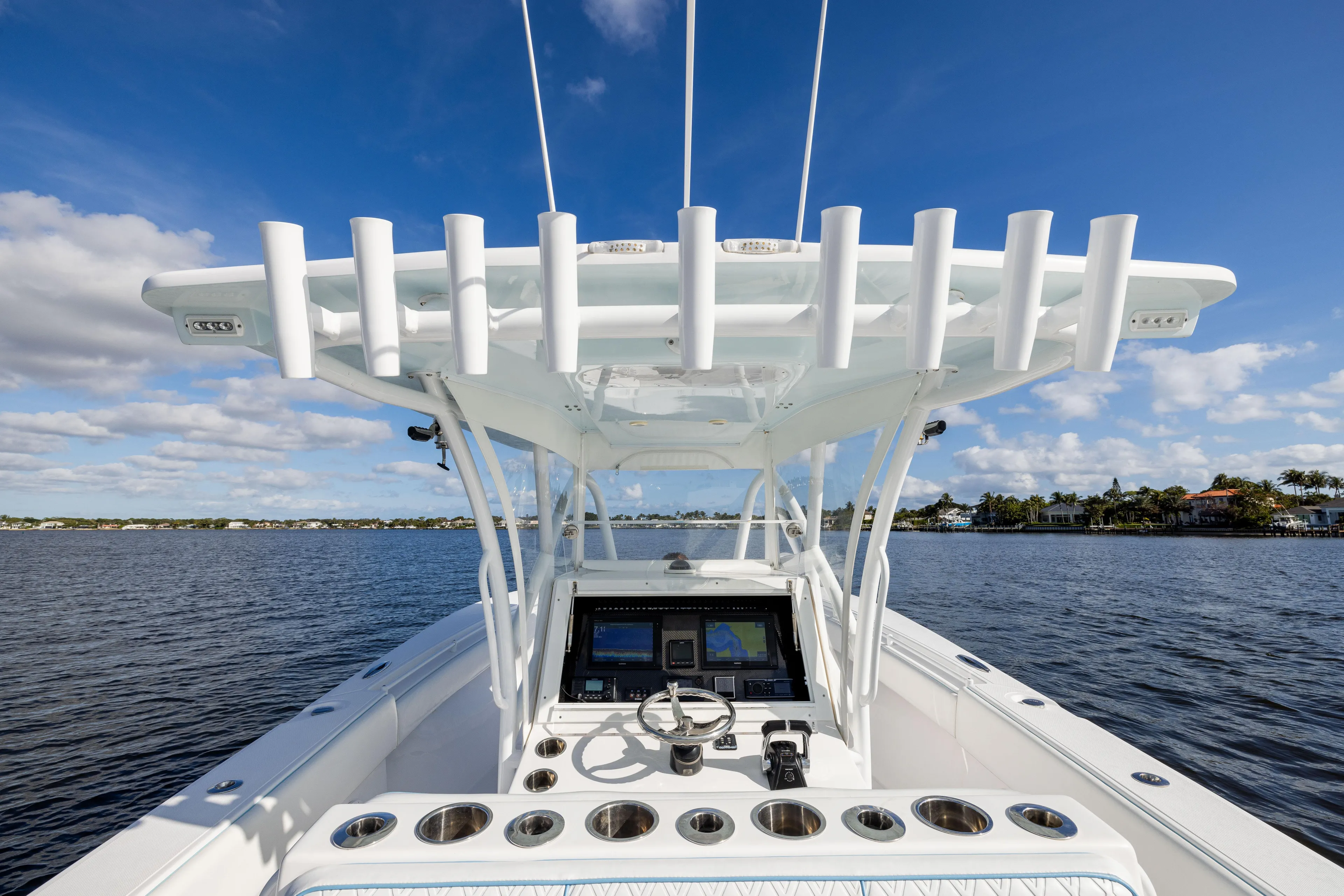 Bloodline Yacht Photos Pics 2018 SeaHunter 33' Center Console boat on calm water under blue sky.