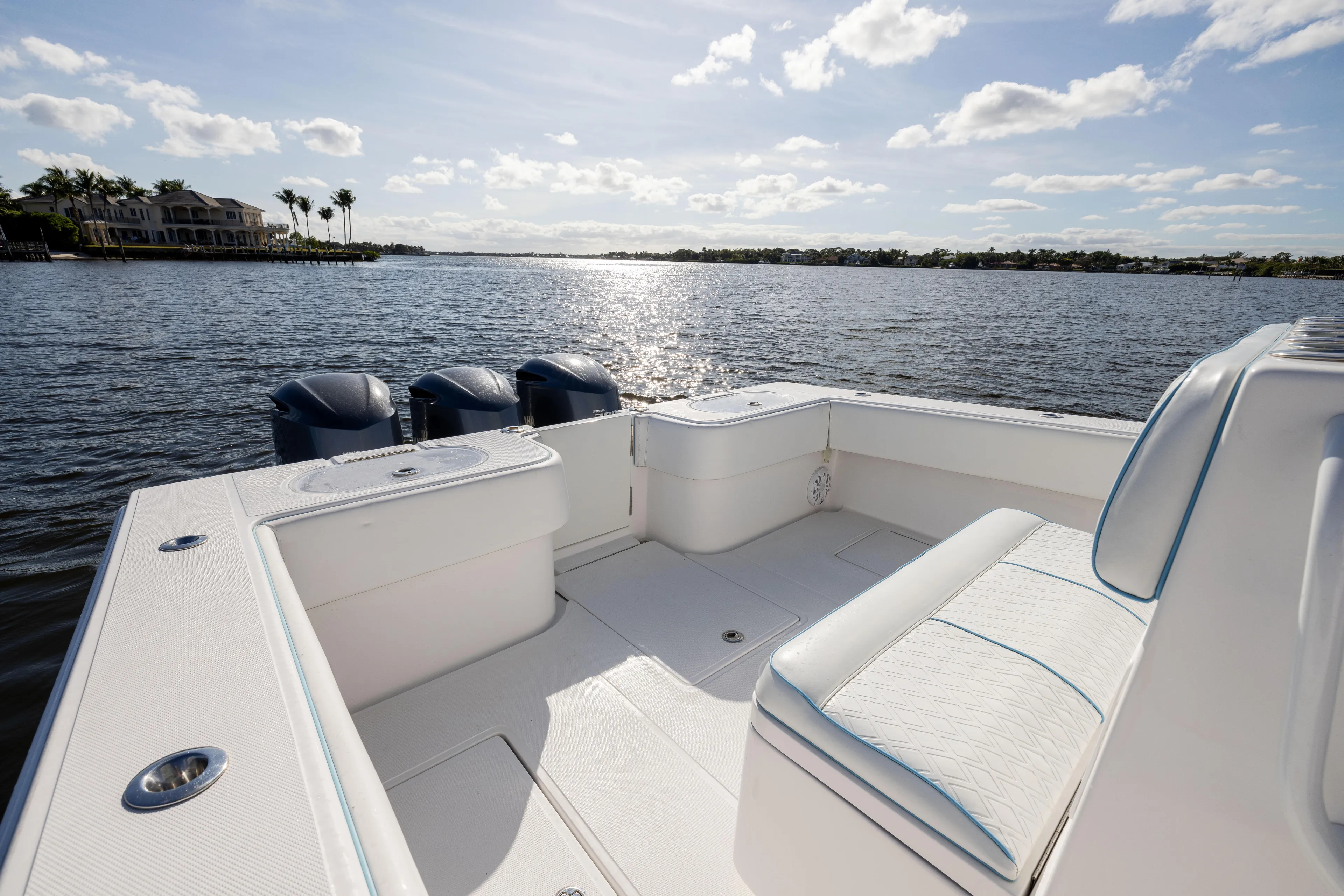 Bloodline Yacht Photos Pics 2018 SeaHunter 33' Center Console boat on calm water, sunny day, spacious seating.