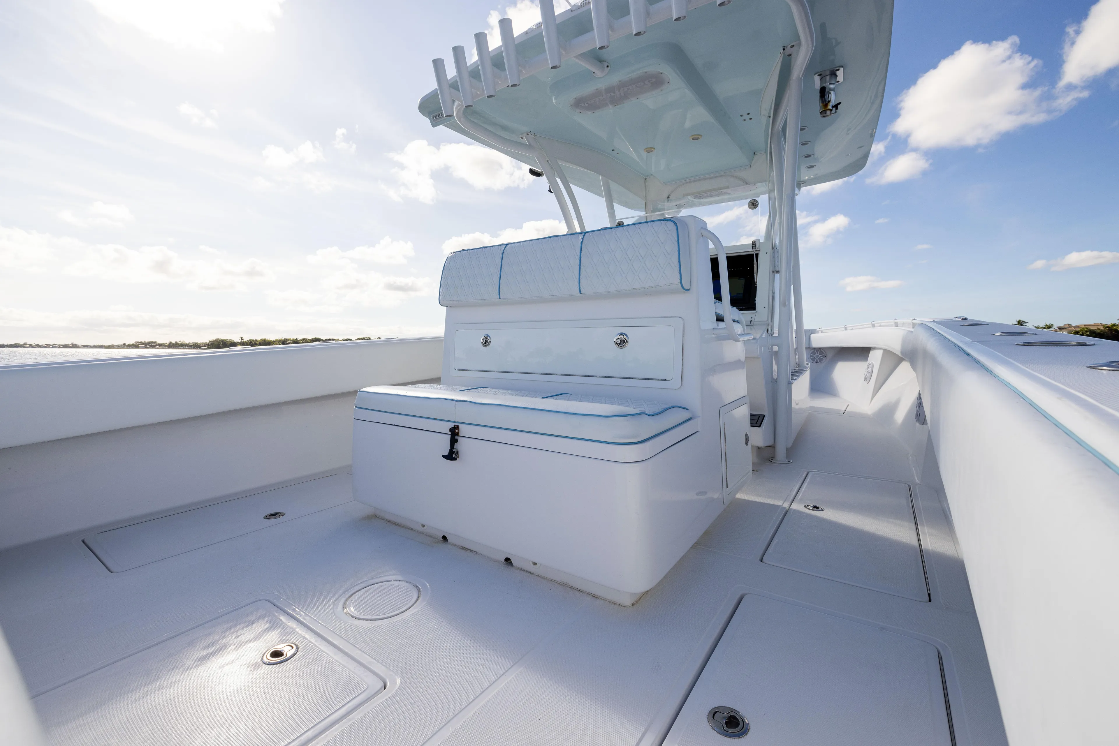 Bloodline Yacht Photos Pics 2018 SeaHunter 33' Center Console boat with spacious deck and seating under clear skies.