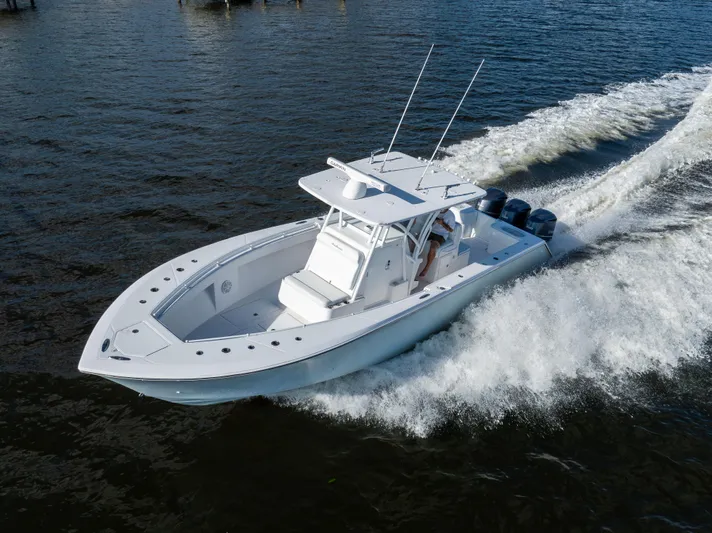 Bloodline Yacht Photos Pics 2018 SeaHunter 33' Center Console boat cruising on open water.