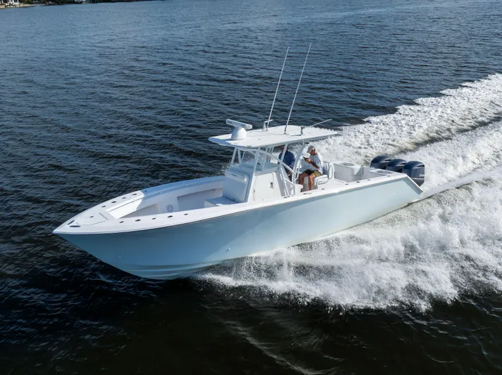 Bloodline Yacht Photos Pics 2018 SeaHunter 33' Center Console boat cruising on open water.