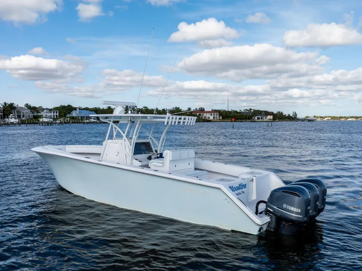 Bloodline Yacht Photos Pics 2018 SeaHunter 33' Center Console boat on calm water, featuring twin Yamaha engines.