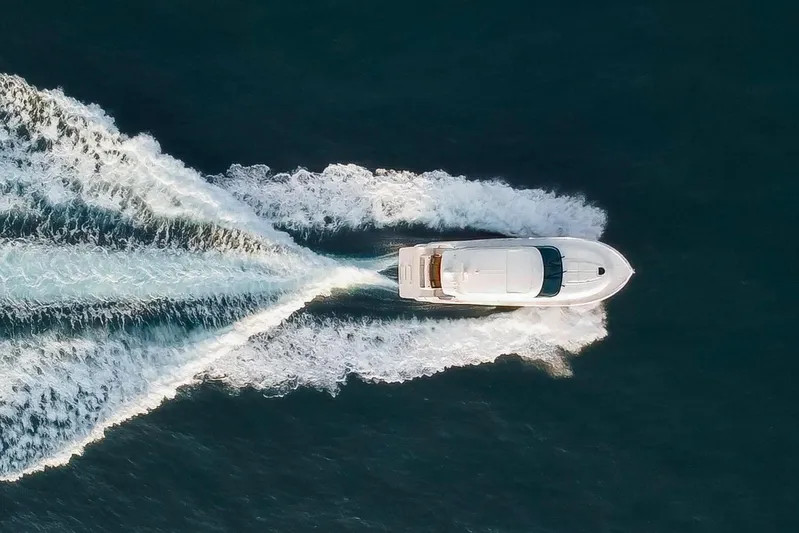 Happy Daze IV Yacht Photos Pics Aerial view of 2017 Tiara Yachts C53 Coupe cruising on open water.