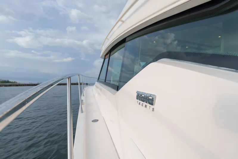 Happy Daze IV Yacht Photos Pics 2017 Tiara Yachts C53 Coupe on water, showcasing sleek design and luxury features.