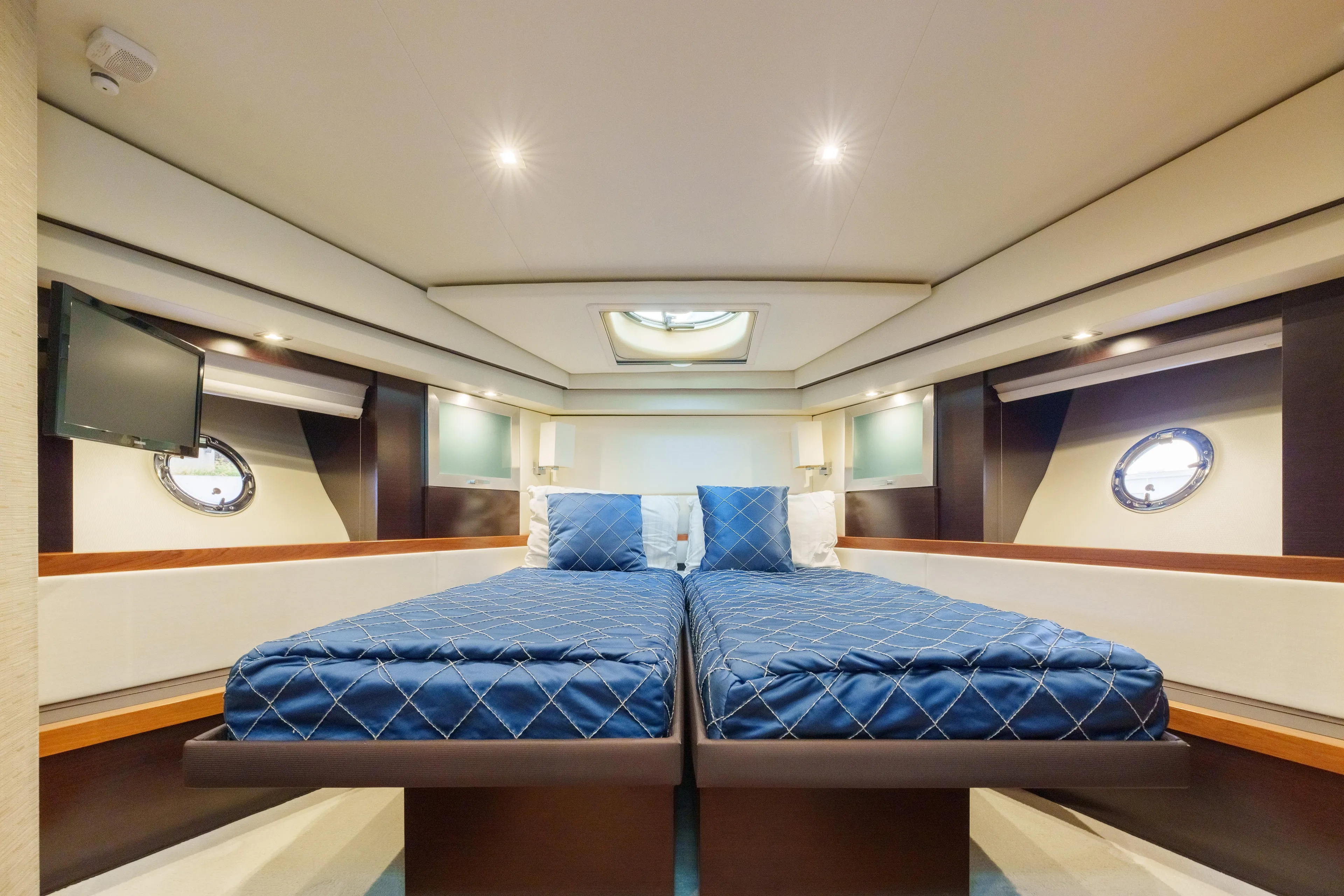 Happy Daze IV Yacht Photos Pics Luxurious 2017 Tiara Yachts C53 Coupe cabin with twin beds and modern amenities.