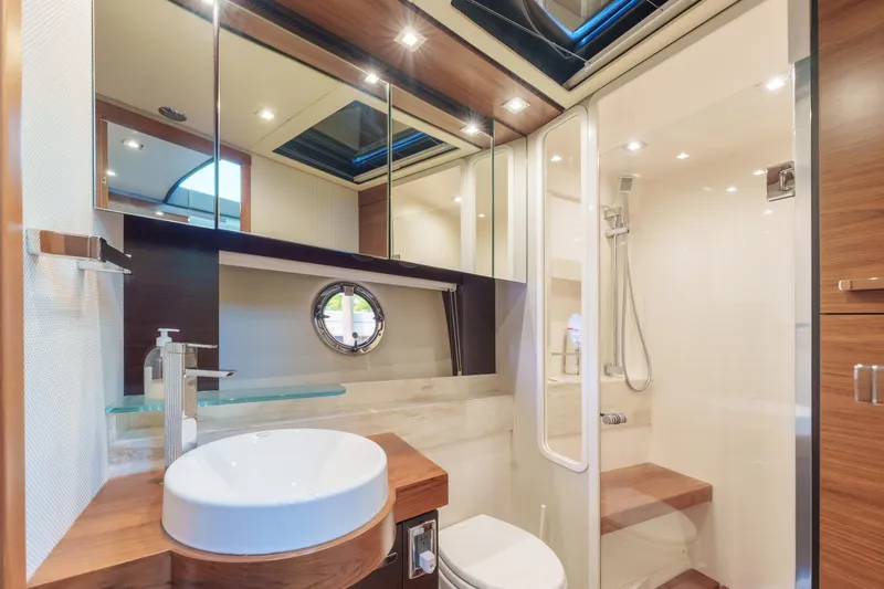 Happy Daze IV Yacht Photos Pics Luxurious bathroom in 2017 Tiara Yachts C53 Coupe with modern fixtures and elegant design.