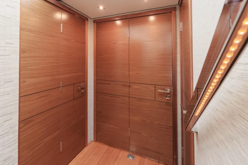 Happy Daze IV Yacht Photos Pics Luxurious wooden interior of 2017 Tiara Yachts C53 Coupe, featuring sleek design and ambient lighting.