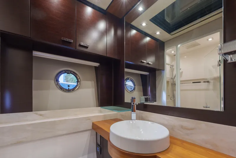 Happy Daze IV Yacht Photos Pics Luxurious bathroom interior of 2017 Tiara Yachts C53 Coupe with modern fixtures.