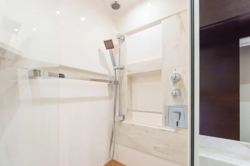 Happy Daze IV Yacht Photos Pics Luxurious shower in 2017 Tiara Yachts C53 Coupe, featuring modern fixtures and elegant design.