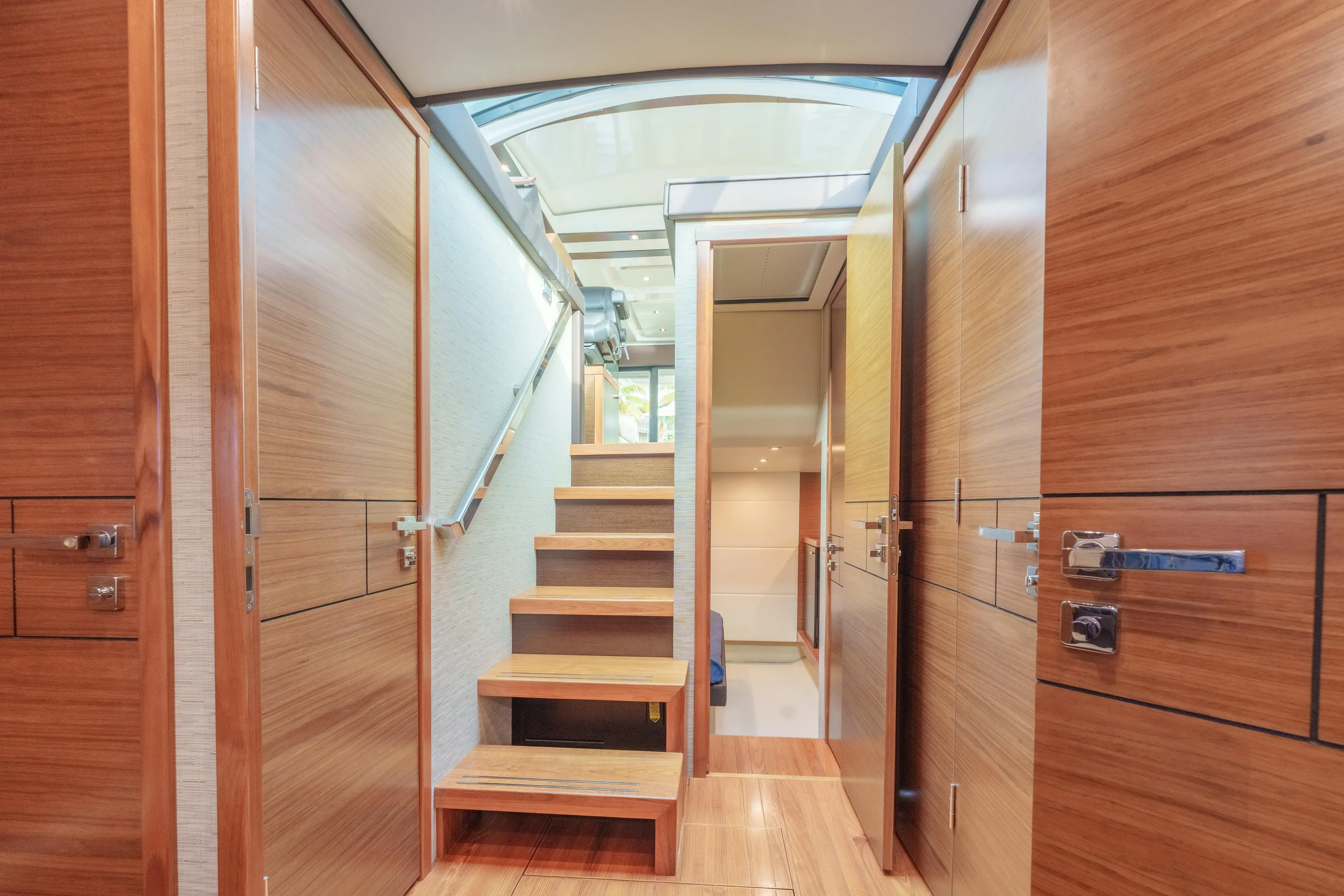 Happy Daze IV Yacht Photos Pics Interior of 2017 Tiara Yachts C53 Coupe with wooden stairs and modern design.