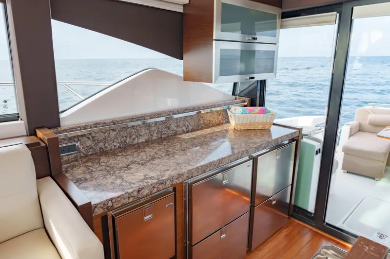 Happy Daze IV Yacht Photos Pics Luxurious interior of 2017 Tiara Yachts C53 Coupe with ocean view and modern amenities.