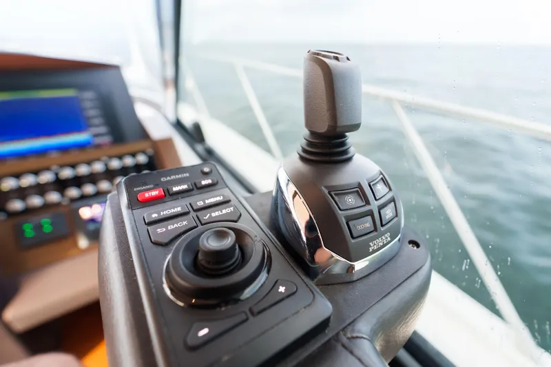 Happy Daze IV Yacht Photos Pics Control panel of 2017 Tiara Yachts C53 Coupe with joystick and navigation buttons.