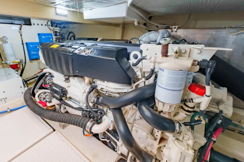 Happy Daze IV Yacht Photos Pics Engine room of 2017 Tiara Yachts C53 Coupe, showcasing detailed mechanical components.