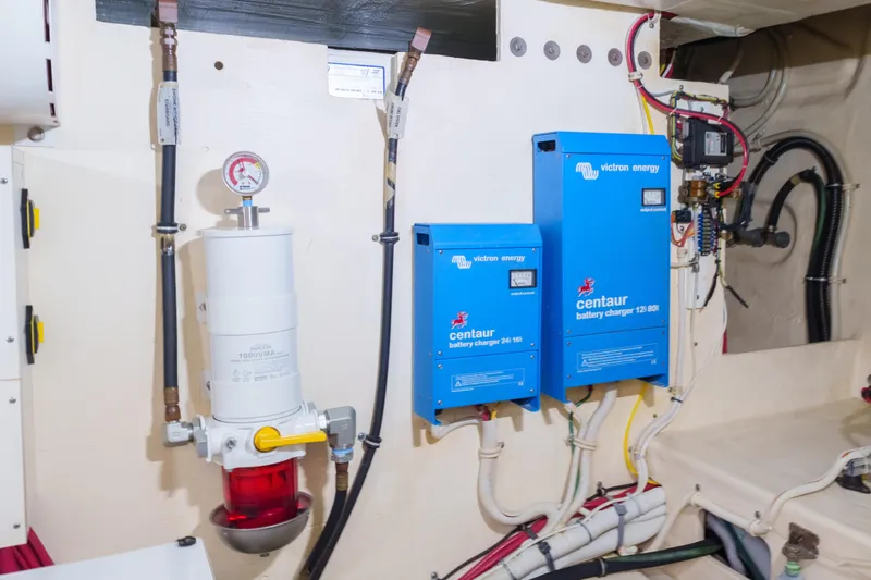 Happy Daze IV Yacht Photos Pics Engine room of 2017 Tiara Yachts C53 Coupe with Victron Energy battery chargers.