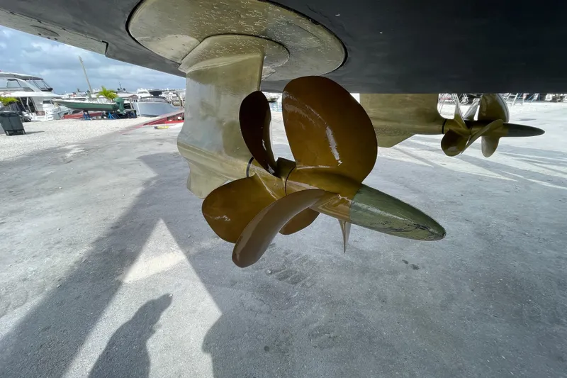 Happy Daze IV Yacht Photos Pics Close-up of 2017 Tiara Yachts C53 Coupe propeller in a boatyard setting.