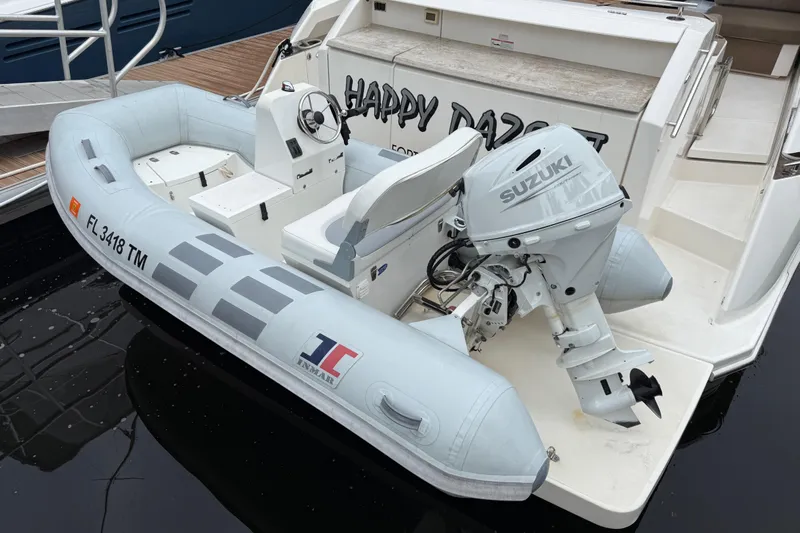 Happy Daze IV Yacht Photos Pics Inflatable boat with Suzuki motor docked on Tiara Yachts C53 Coupe, 2017 model.