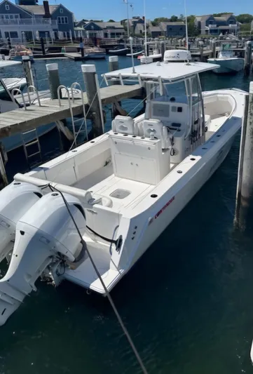 White Cap Yacht Photos Pics 2016 Contender 32 ST boat docked at marina, featuring dual outboard engines.