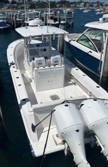 White Cap Yacht Photos Pics 2016 Contender 32 ST boat docked with twin engines, white exterior.