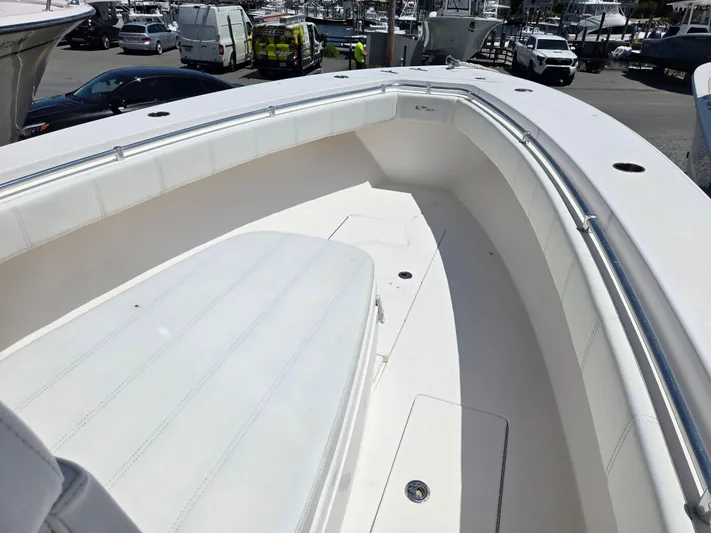 White Cap Yacht Photos Pics 2016 Contender 32 ST boat interior with white seating and spacious deck.