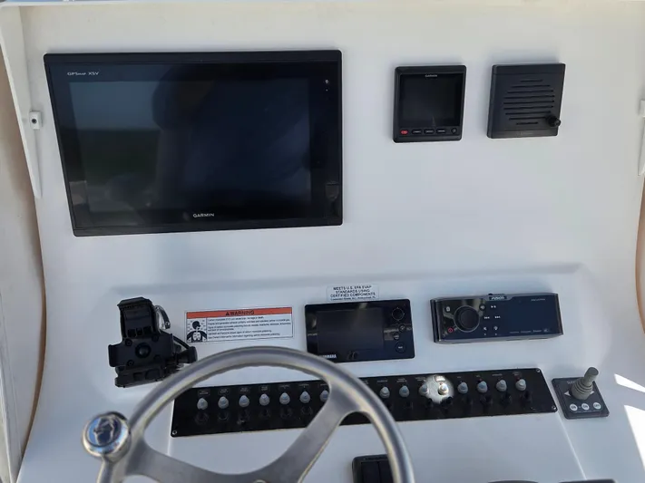White Cap Yacht Photos Pics 2016 Contender 32 ST boat dashboard with Garmin electronics and control panel.