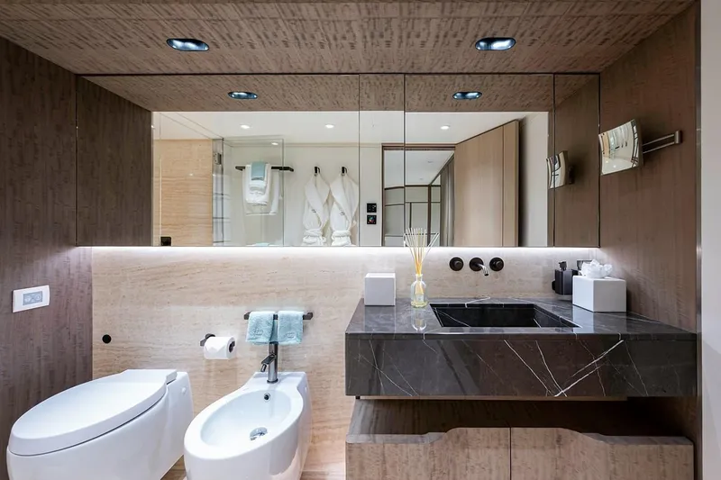 Checked Out Yacht Photos Pics Luxurious 2020 Majesty 140 yacht bathroom with modern fixtures and elegant design.