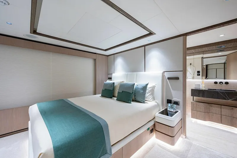 Checked Out Yacht Photos Pics Luxurious bedroom interior of 2020 Majesty 140 yacht with modern design and elegant decor.