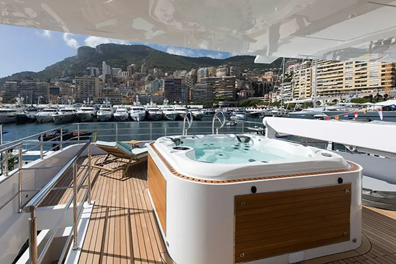 Checked Out Yacht Photos Pics Luxury yacht Majesty 140 with jacuzzi, docked in a scenic marina, 2020 model.