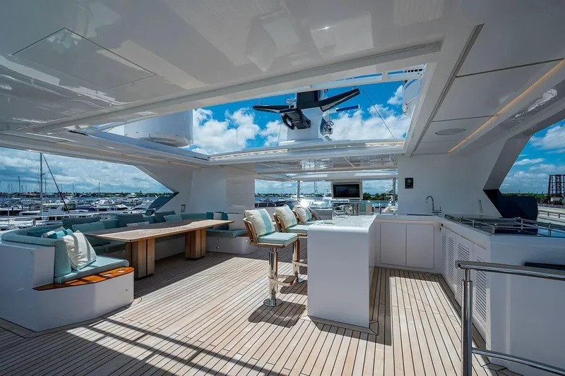 Checked Out Yacht Photos Pics Luxurious 2020 Majesty 140 yacht deck with modern seating and open sky view.