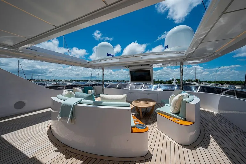 Checked Out Yacht Photos Pics Luxurious 2020 Majesty 140 yacht deck with elegant seating and ocean view.