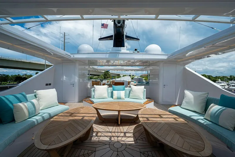 Checked Out Yacht Photos Pics Luxurious 2020 Majesty 140 yacht interior with elegant seating and wooden accents.
