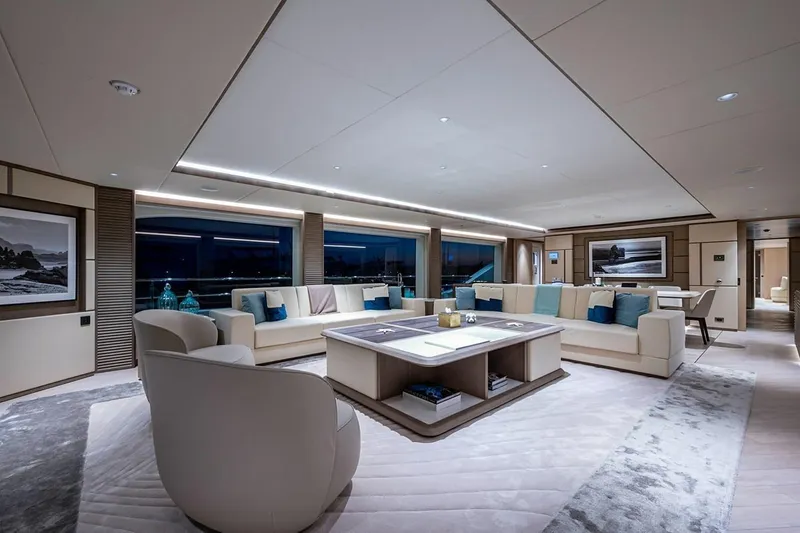 Checked Out Yacht Photos Pics Luxurious interior of 2020 Majesty 140 yacht with modern furnishings and panoramic windows.