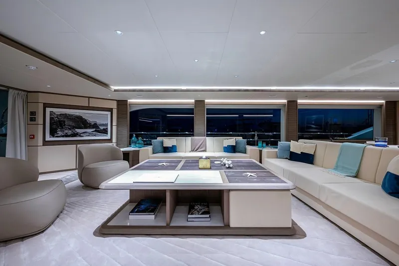 Checked Out Yacht Photos Pics Luxurious interior of 2020 Majesty 140 yacht with elegant seating and modern decor.