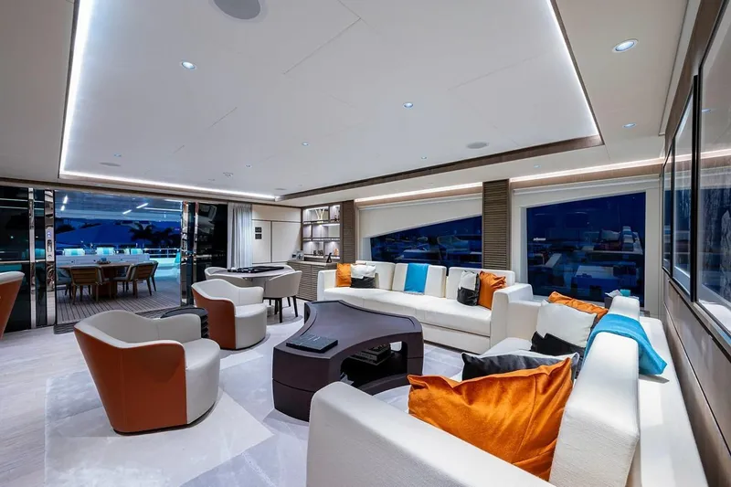 Checked Out Yacht Photos Pics Luxurious interior of 2020 Majesty 140 yacht with modern seating and vibrant cushions.