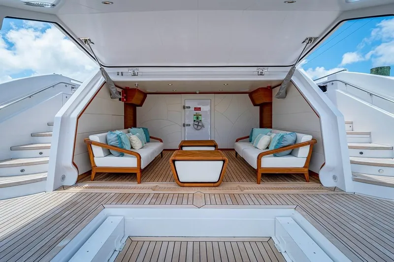 Checked Out Yacht Photos Pics Luxurious 2020 Majesty 140 yacht interior with elegant seating and wooden accents.