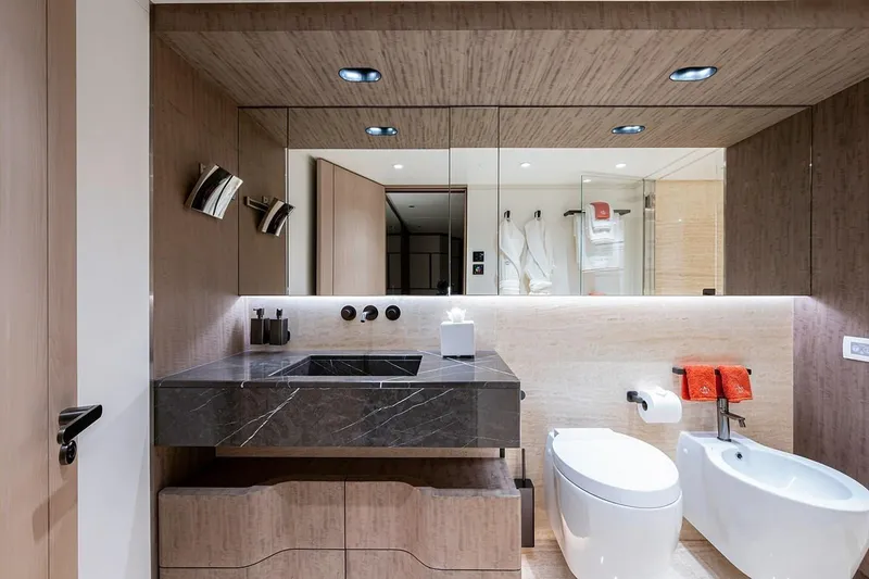 Checked Out Yacht Photos Pics Luxurious bathroom on 2020 Majesty 140 yacht with modern fixtures and elegant design.