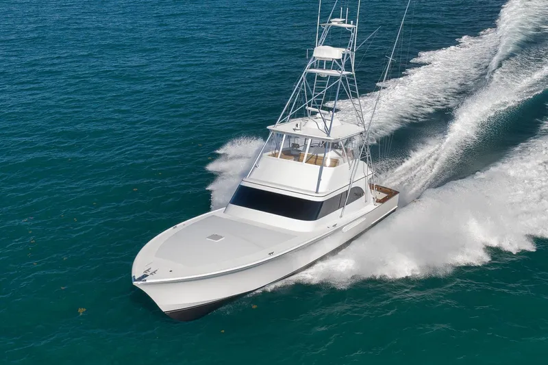 Pistol Yacht Photos Pics 2002 Weaver 60 Convertible yacht cruising on open blue waters.