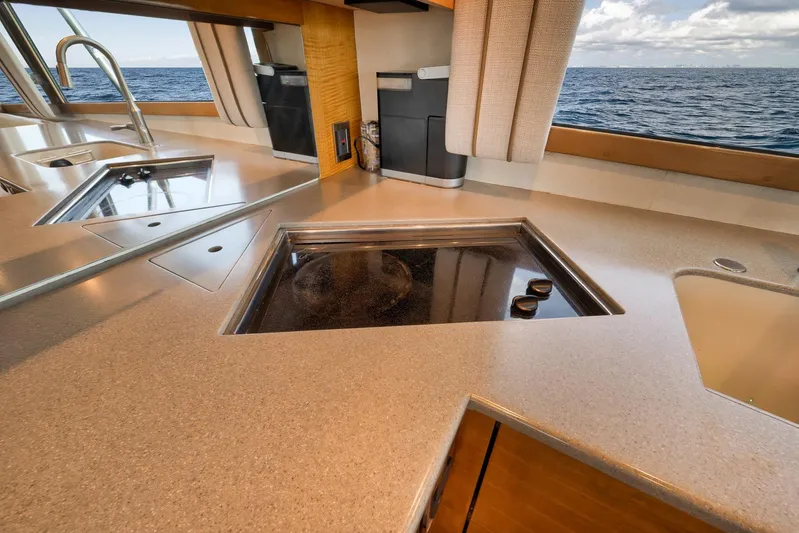 Pistol Yacht Photos Pics Luxurious kitchen interior on 2002 Weaver 60 Convertible yacht with ocean view.