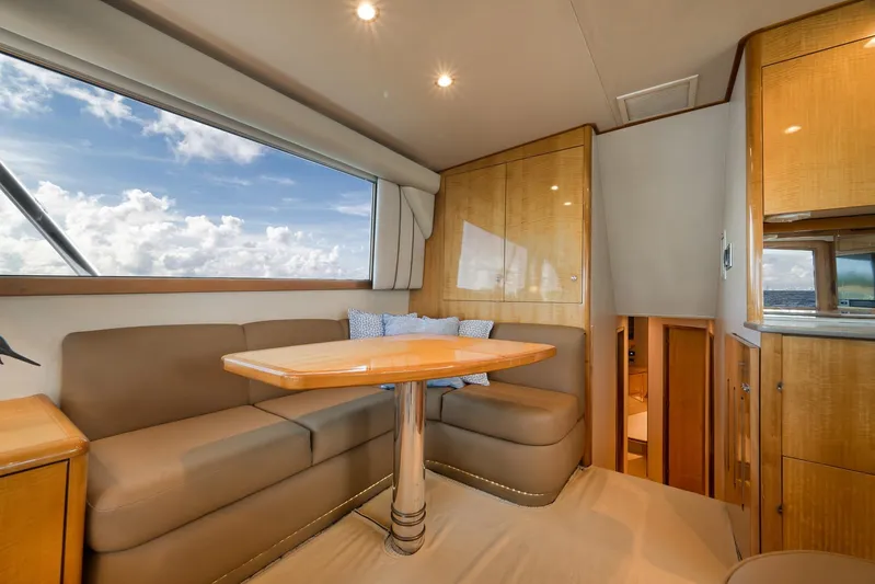 Pistol Yacht Photos Pics Luxurious interior of 2002 Weaver 60 Convertible yacht with plush seating and ocean view.