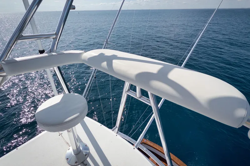 Pistol Yacht Photos Pics Luxury Weaver 60 Convertible yacht helm overlooking serene ocean, 2002 model.