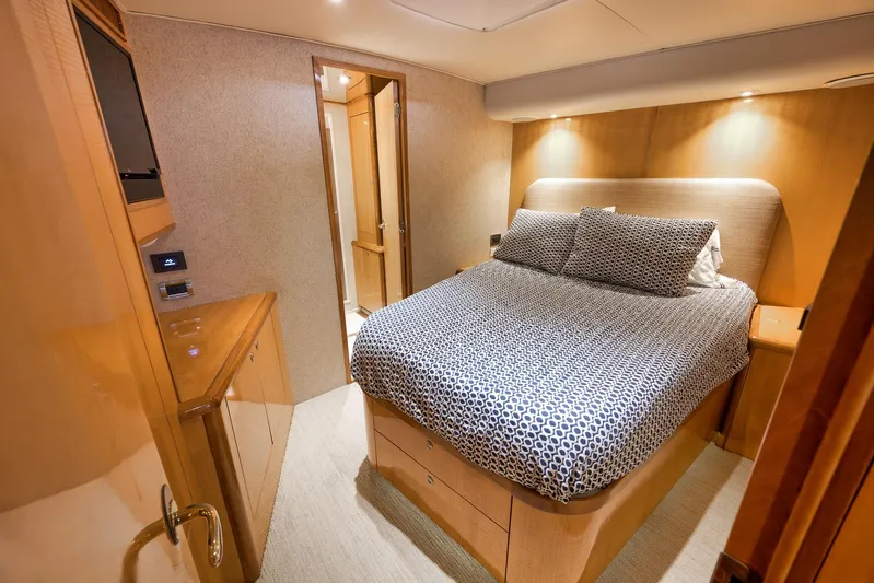 Pistol Yacht Photos Pics Luxurious bedroom interior of 2002 Weaver 60 Convertible yacht with modern decor.